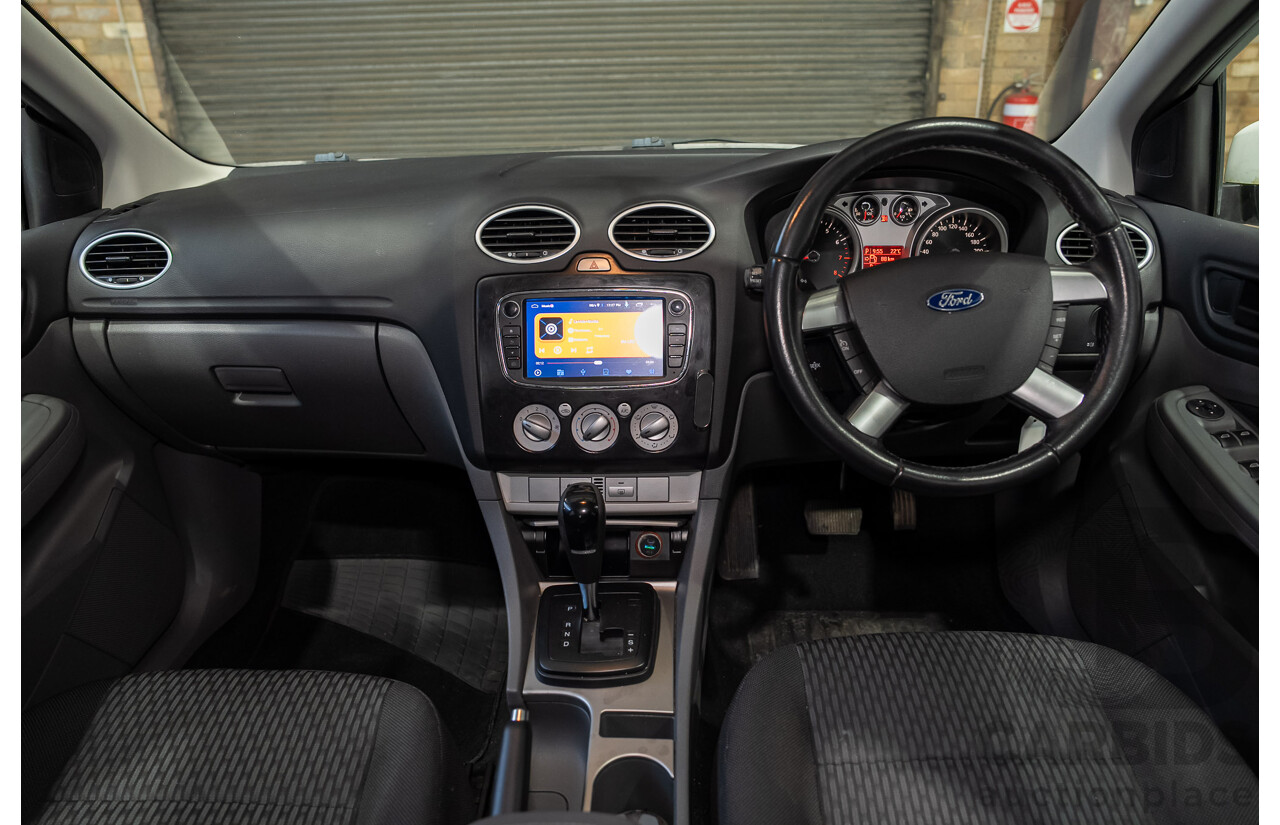 03/2010 Ford Focus LX FWD LV 5d Hatchback White 2.0L