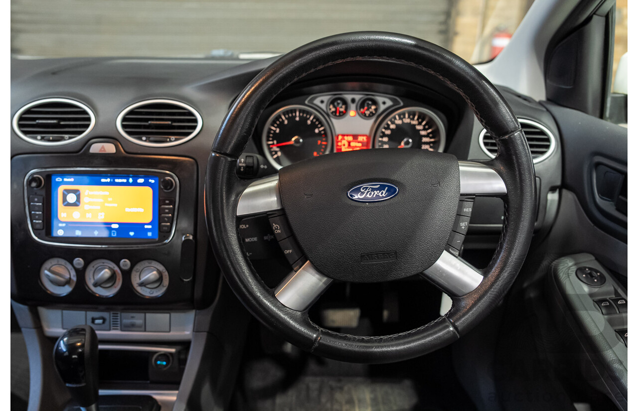 03/2010 Ford Focus LX FWD LV 5d Hatchback White 2.0L